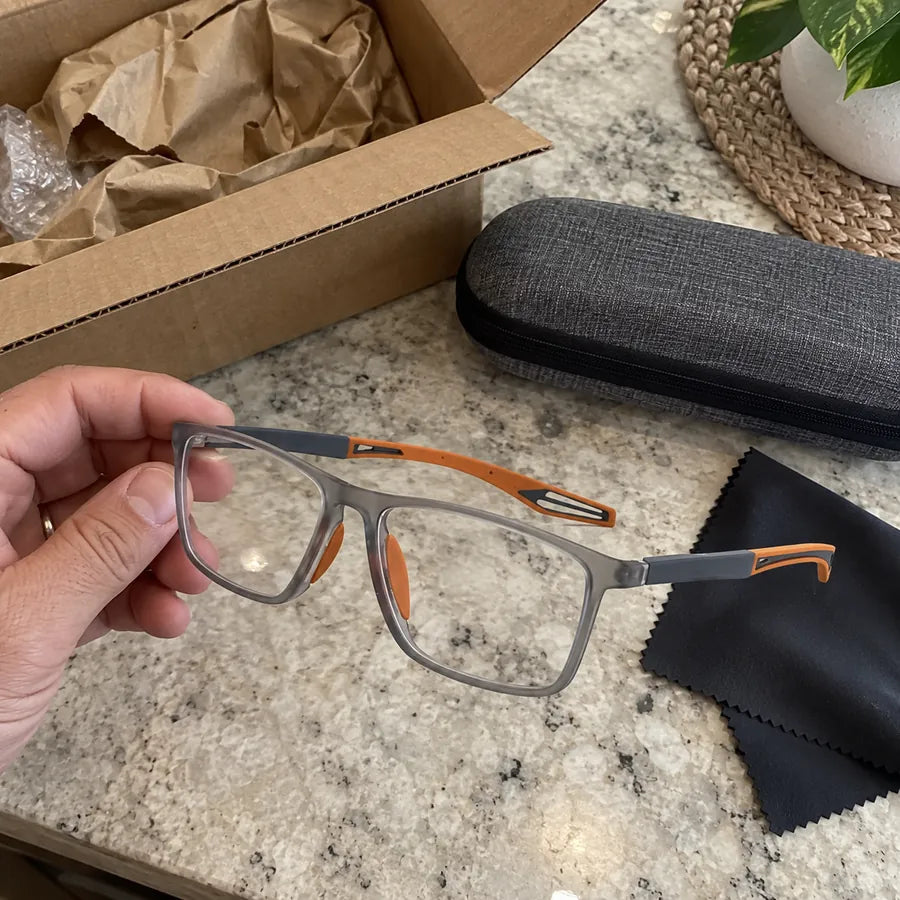 Gray and orange glasses after unboxing with case and cleaning cloth