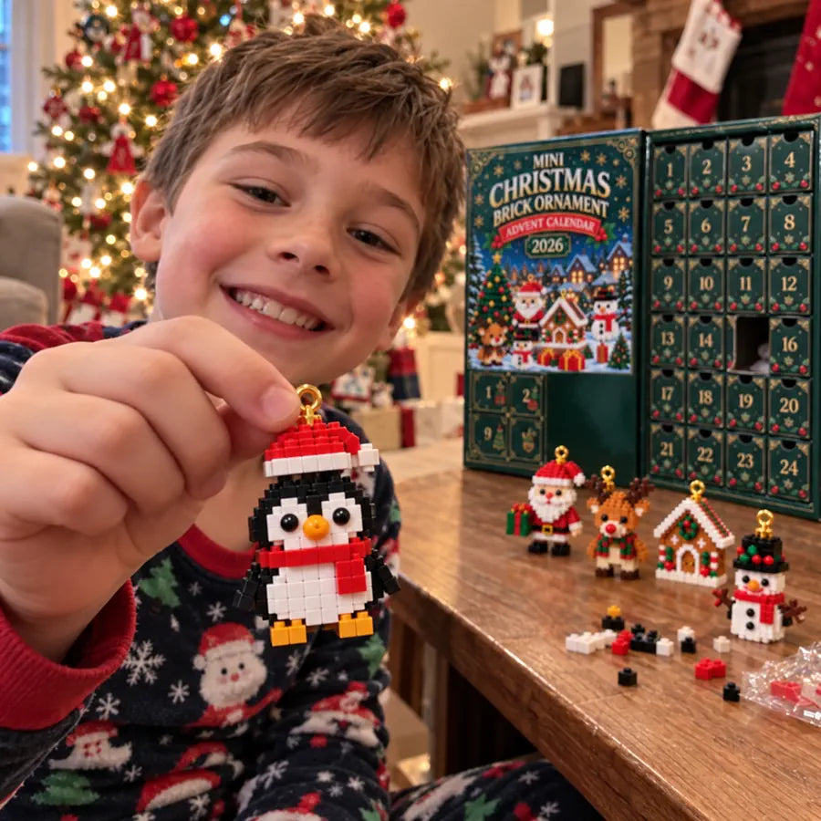 Child smiling while holding a finished Christmas brick ornament
